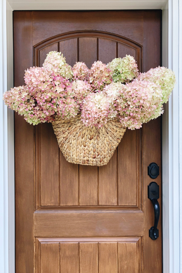 How to easily make a stunning dried hydrangea fall "wreath" for your front door.