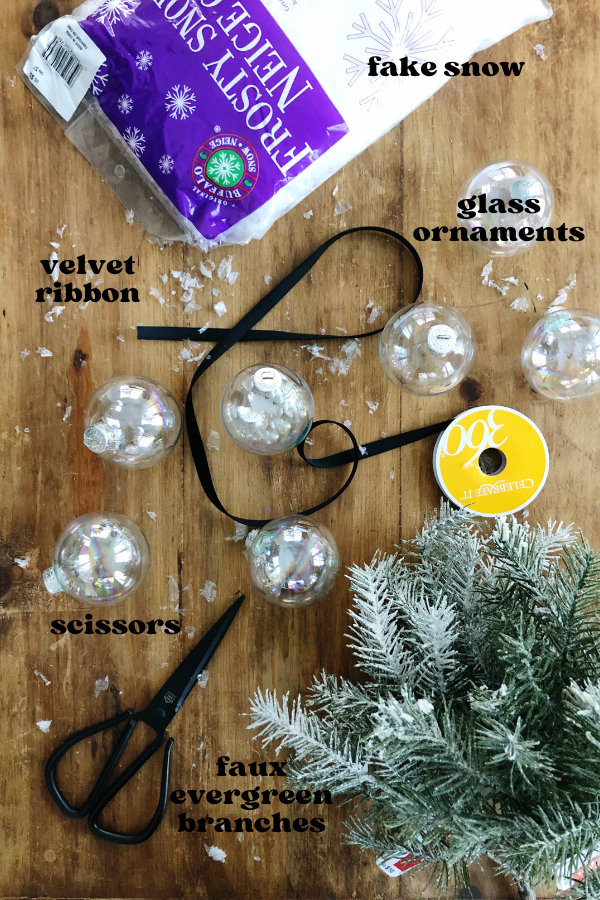 Looking for a quick and easy DIY Christmas ornament to make with your kids? This snow globe ornament is cute, cheap and fun! Perfect for gifting to teachers, neighbors, or grandparents. Make holiday memories with your little one while making these adorable ornaments with just a few simple supplies!