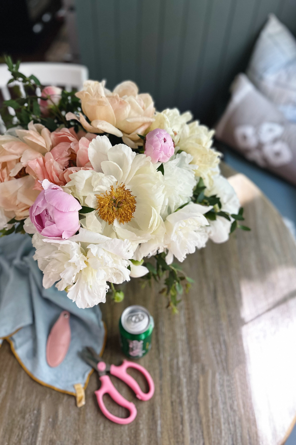 Unlock my secret to a beautiful peony flower arrangement with my tips and tricks featuring lush white, pink, and coral peonies.