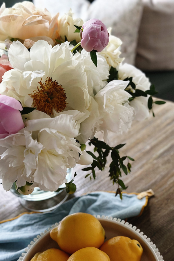 Discover my secret to creating a beautiful peony flower arrangement with stunning white, pink, and coral blooms! Plus how to best take care of your bouquet.