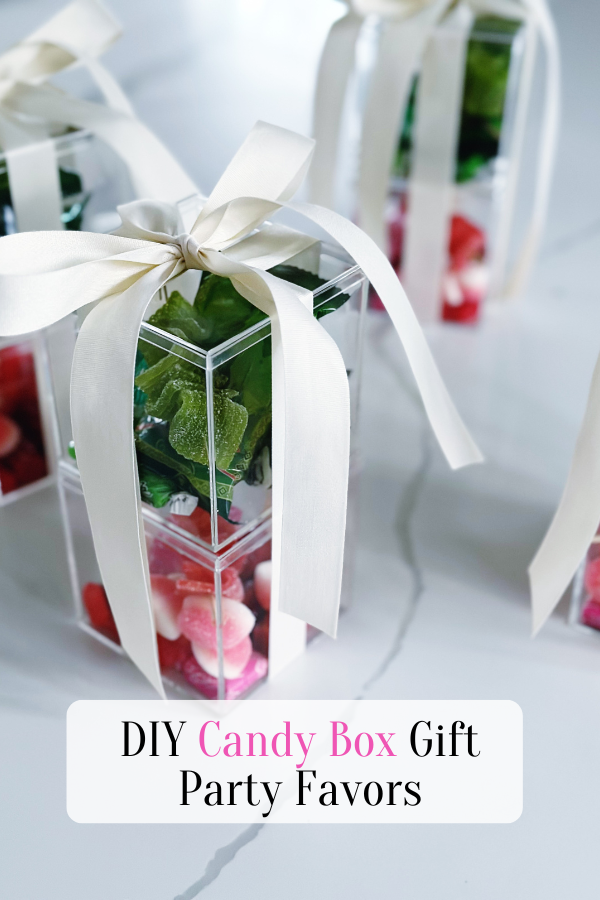 Styled image of DIY candy boxes tied with a ribbon, perfect to pin to your Pinterest board for inspiration on gift ideas.