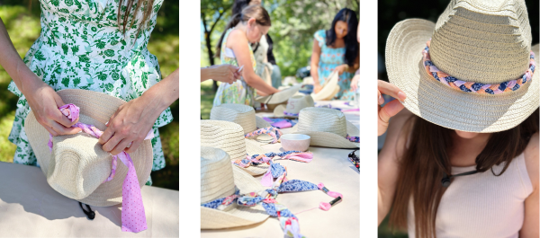 A group of women and a young girl gathered around an outdoor crafting table, decorating straw cowboy hats at a cowgirl party. The women are dressed in light, breezy outfits, embracing the coastal cowgirl aesthetic. This setup is ideal for cowgirl bachelorette parties or a cowgirl birthday.