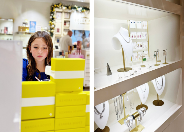 The photo is split into two. On the left side is a girl in a blue dress looking at a jewelry vendor display with several bright yellow Kendra Scott jewelry gift boxes in the foreground. On the right is a picture of a jewelry vendor display featuring bracelets, necklaces, rings and earrings. 