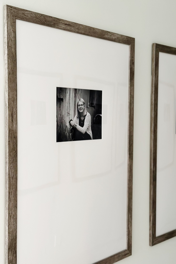 Modern hallway decor featuring large framed photos with 24x36 frame on wall, a classic and stylish way to showcase family memories in a neutral home.